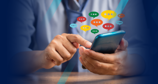 An HR manager on a smartphone typing in performance review comments