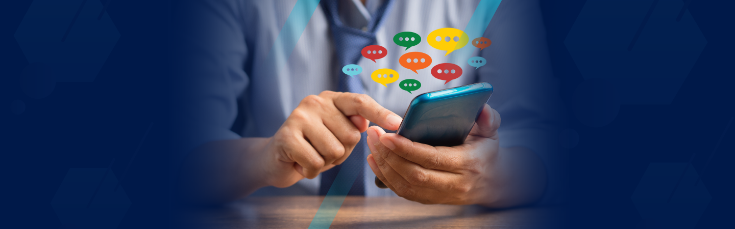 An HR manager on a smartphone typing in performance review comments