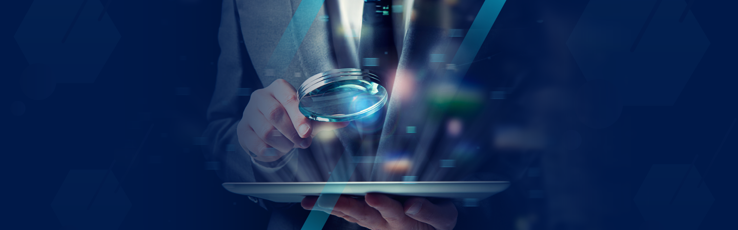 A persona in a suit holding a magnifying glass signifying looking at what triggers I-9 audits